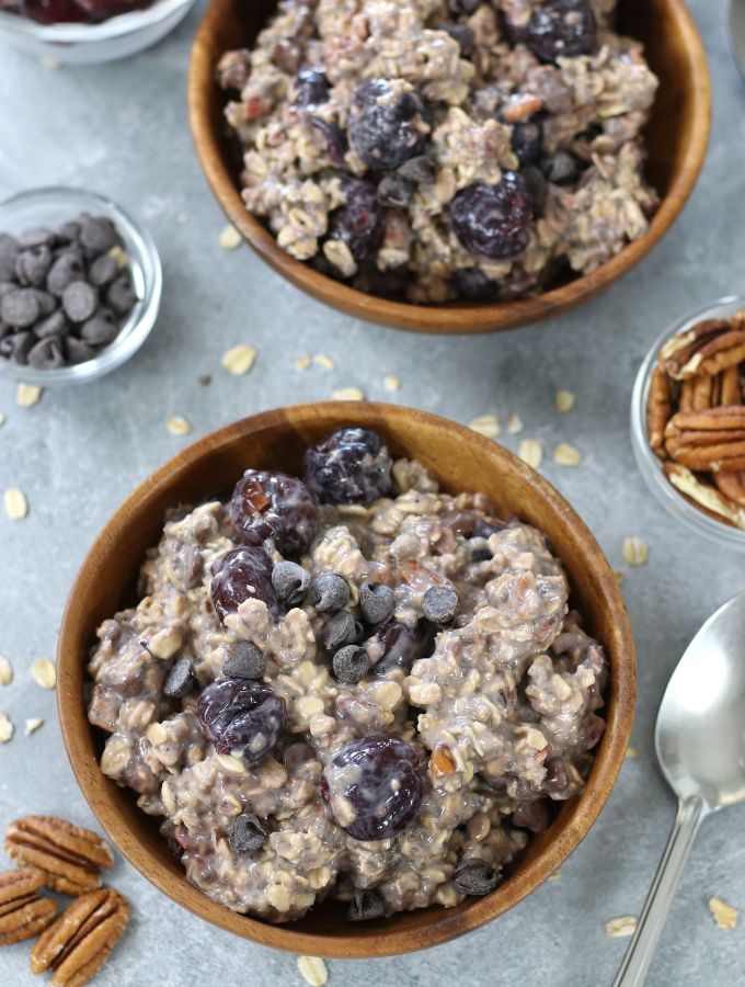 Overhead photo of Cherry Overnight Oats served in brown bowls.