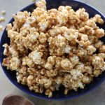 A big blue bowl of Peanut Butter Popcorn.