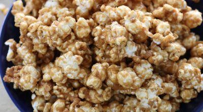 A big blue bowl of Peanut Butter Popcorn.