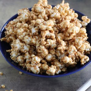 Peanut Butter Popcorn made without corn syrup sitting in a bowl on a countertop.