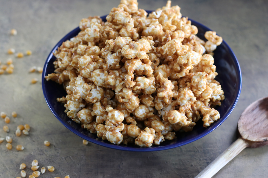Peanut Butter Popcorn made without corn syrup sitting in a bowl on a countertop.