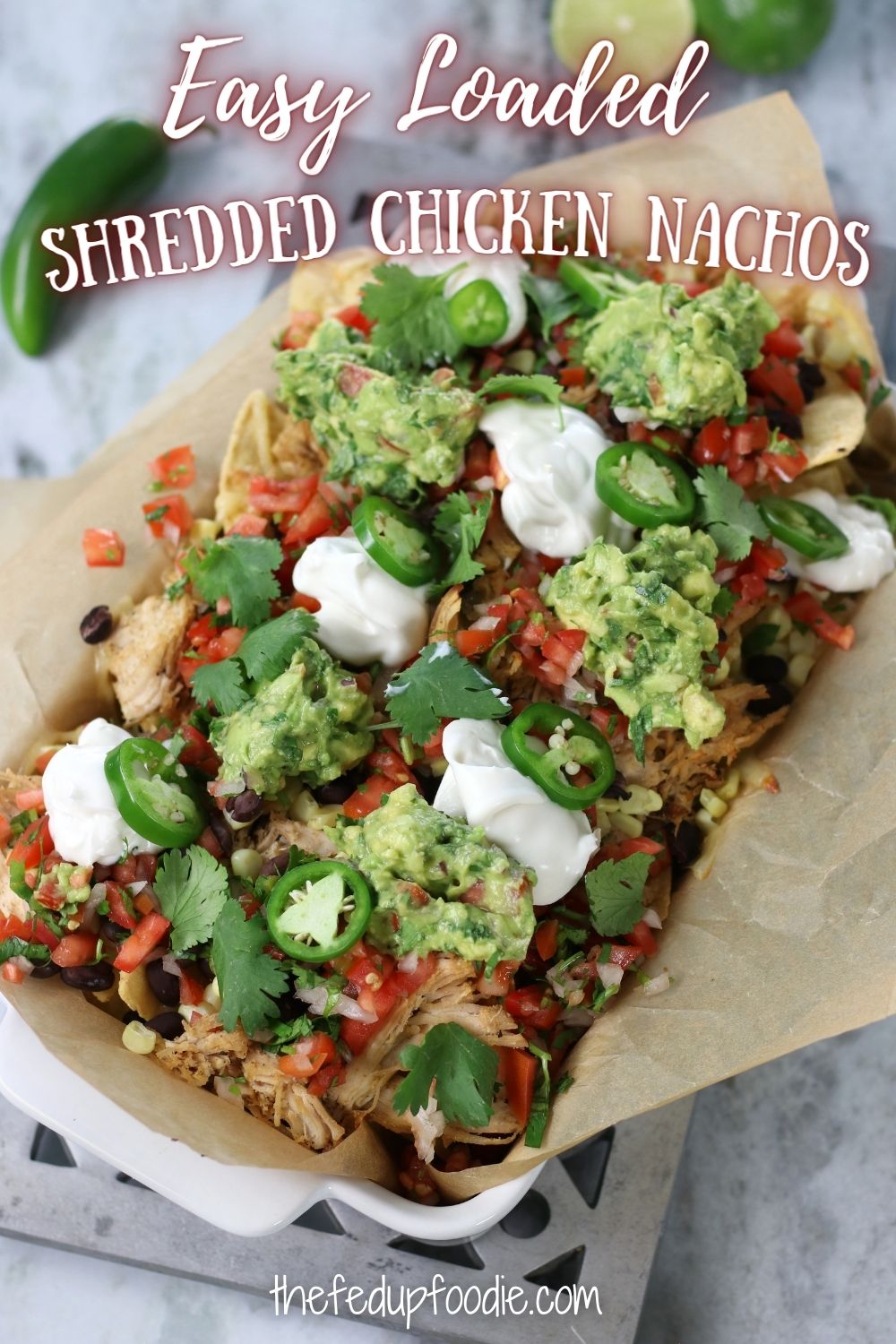 Shredded Chicken Nachos is an easy family favorite recipe. Loaded with mouthwatering toppings like Homemade Guacamole, Pico de Gallo, Jack Cheese and sour cream. This dinner is crunchy, tasty and completely satisfying. 
#ShreddedChickenRecipes #ShreddedChickenNachos #ShreddedChickenNachosEasy #ShreddedChickenNachosRecipeEasy #ShreddedChickenNachosAirFryer #LoadedNachosRecipeChicken #ChickenNachosRecipeEasy 