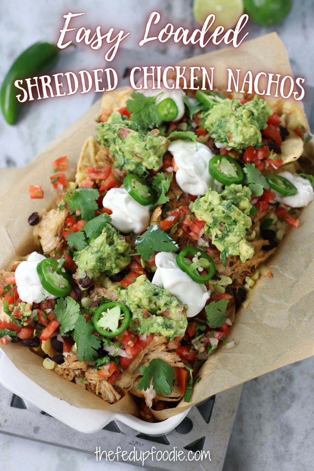 Shredded Chicken Nachos is an easy family favorite recipe. Loaded with mouthwatering toppings like Homemade Guacamole, Pico de Gallo, Jack Cheese and sour cream. This dinner is crunchy, tasty and completely satisfying. 
#ShreddedChickenRecipes #ShreddedChickenNachos #ShreddedChickenNachosEasy #ShreddedChickenNachosRecipeEasy #ShreddedChickenNachosAirFryer #LoadedNachosRecipeChicken #ChickenNachosRecipeEasy 