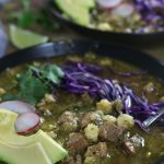 Up close photo of a bowl of Pork Pozole Verde.