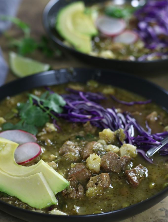 Up close photo of a bowl of Pork Pozole Verde.