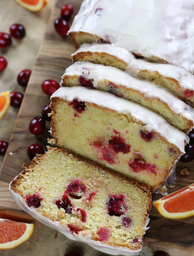 Overhead photo of a sliced Orange Cranberry Bread with an orange glaze.
