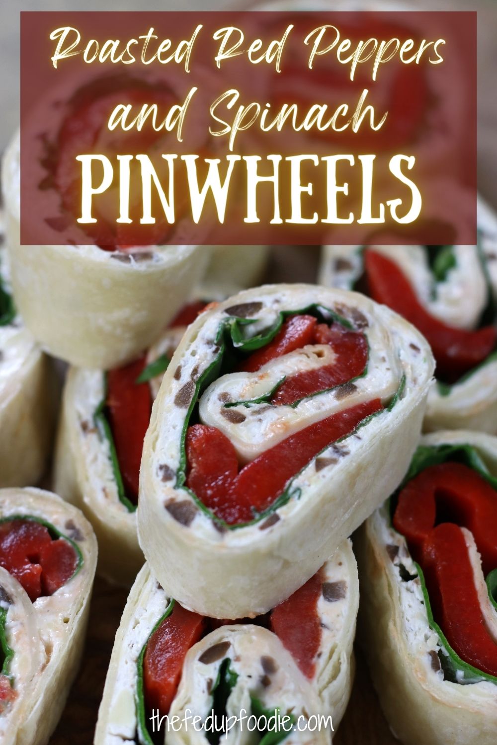 These Spinach Pinwheels with roasted red peppers are incredibly easy to make and perfectly festive for holiday tables. A blend of cream cheese, olives and cheddar makes for a luxuriously creamy appetizer that is loaded with flavor.  #HolidayAppetizers #HolidayAppetizersEasy #PinwheelAppetizers #EasyPinwheelAppetizers #TortillaRollUps #BestPinwheelAppetizersCreamCheeses