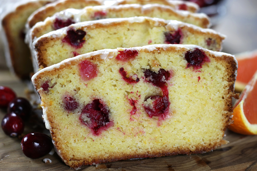 Up close photo of a slice of Cranberry Orange Loaf.