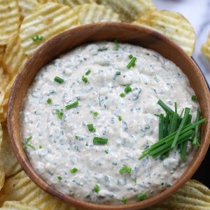 Overhead photo of Garlic Dip surrounded by wavy potato chips.