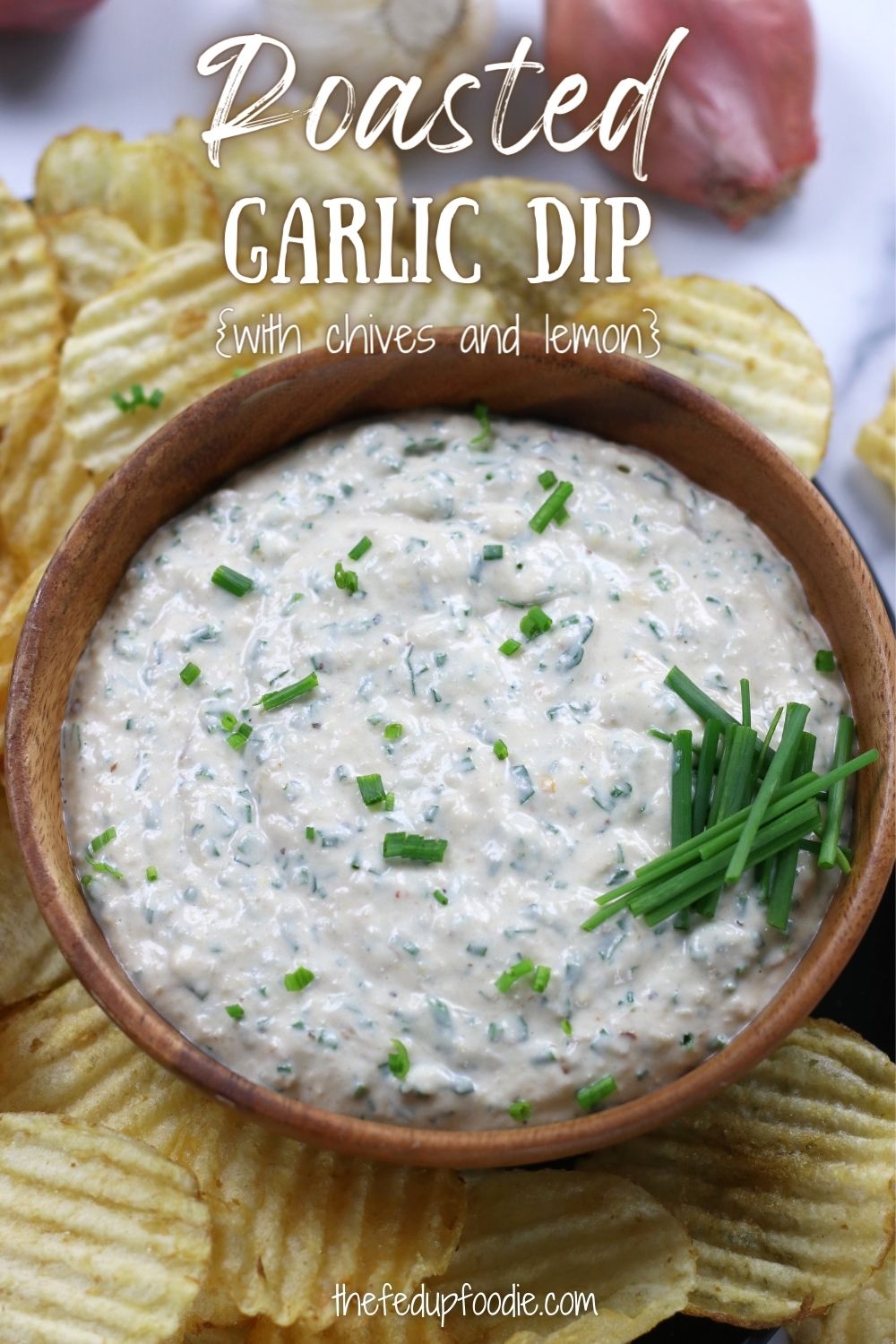 Roasted Garlic Dip is creamy and savory with bright flavors. Roasting the garlic creates a mild sweet and yet savory companion to the caramelized shallots. Lemon, chives and parsley brings in a brightness that makes this dip amazing as an appetizer and compliments veggies. #RoastedGarlicDip #RoastedGarlicDipAppetizers #RoastedGarlicRecipes #AppetizerRecipes #RoastedGarlicAndOnionDip 