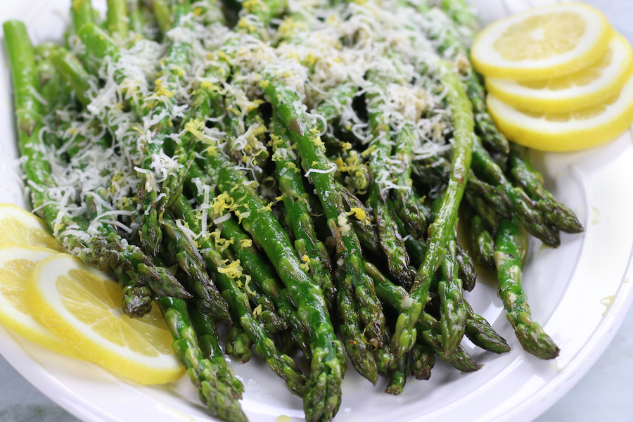 Up close photo of prepared and garnished Roasted Asparagus baked at 425 degrees.