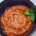 Overhead photo of Roasted Red Pepper Dip in a blue bowl.