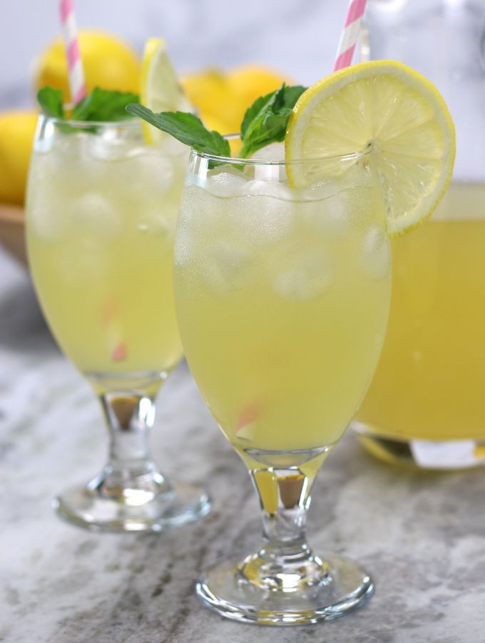 The Best Lemonade recipe poured into two glasses.