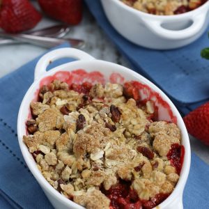 Two servings of Strawberry Crumble Recipe served in white ramekins.