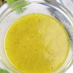 Overhead photo of White Balsamic Vinaigrette in a clear glass bowl.