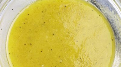 Overhead photo of White Balsamic Vinaigrette in a clear glass bowl.