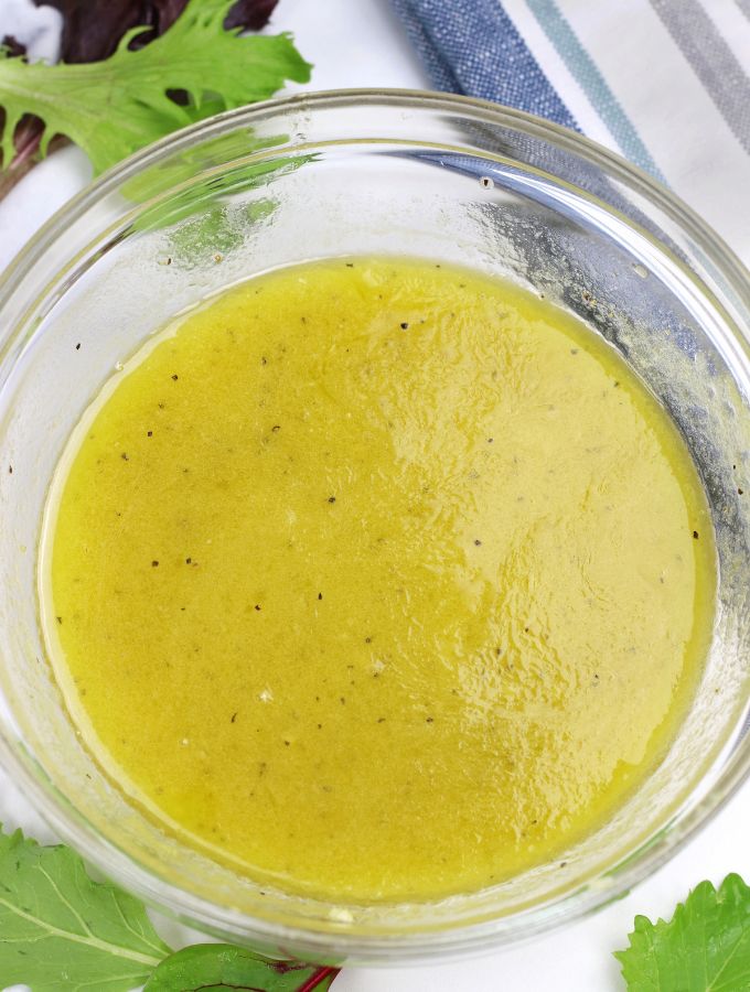 Overhead photo of White Balsamic Vinaigrette in a clear glass bowl.