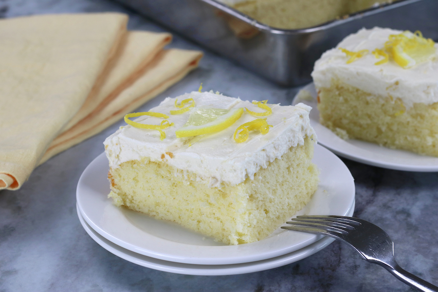 A square slice of Easy Lemon Cake Recipe that is fully from-scratch.