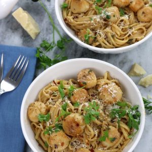 Overhead photo of Scallop Linguine served in white bowls.