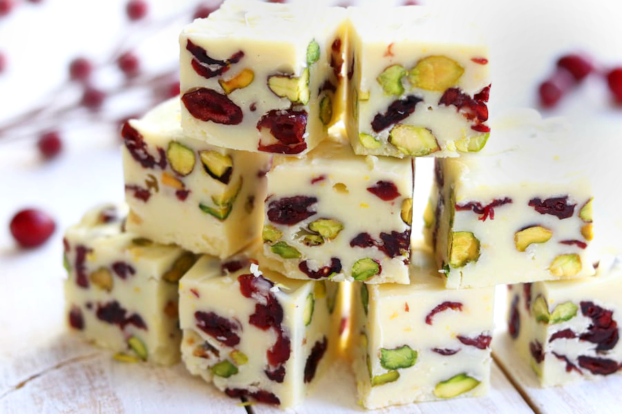 Three rows of White Chocolate Fudge flavored with orange, dried cranberries and pistachios.
