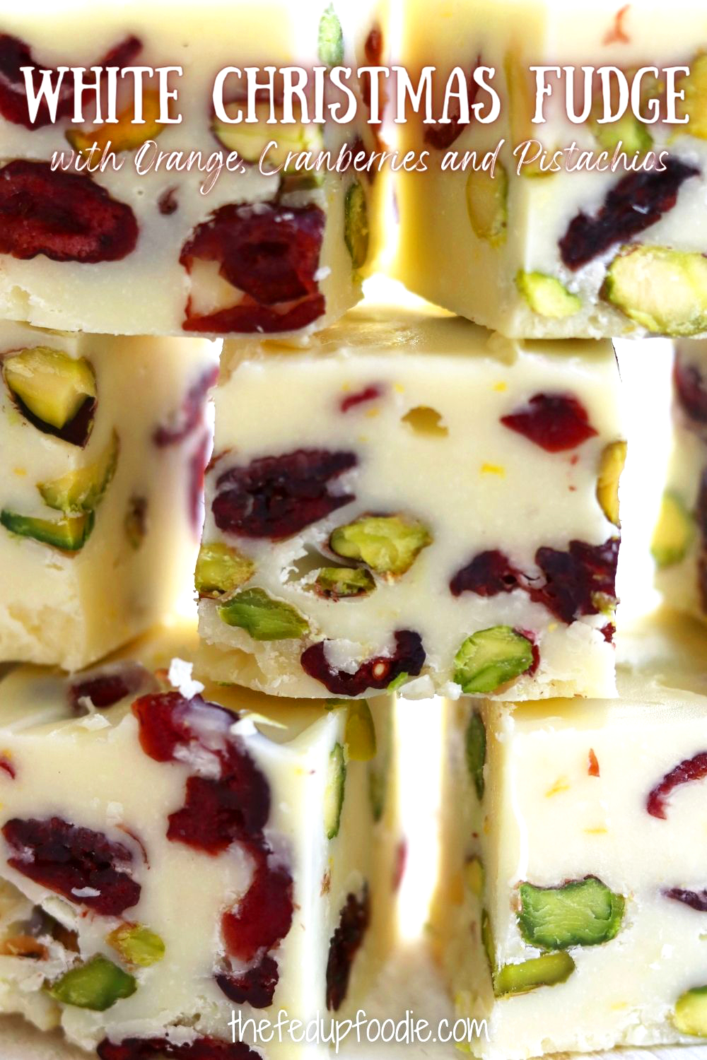 White Christmas Fudge is not only incredibly easy to make, it is also a beautiful addittion to your holiday table. Made with creamy white chocolate, chewy dried cranberries and buttery pistachios. Additionally, this fudge is kissed with the bright citrus flavor of orange. It a mildly sweet and festive treat that also makes a beautiful homemade gift. #WhiteFudge #WhiteFudgeRecipeEasy #WhiteChocolateFudge #WhiteChocolateFudgeCondensedMilk #WhiteChristmasFudge