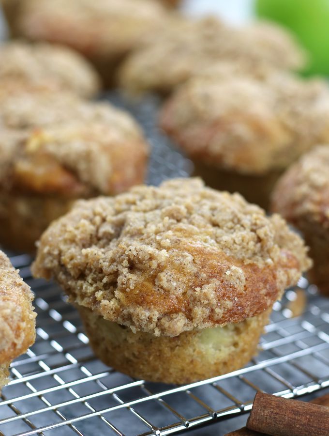 Moist Apple Spice Muffins sitting on a cooling rack.