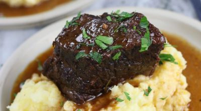 Red Wine Braised Short Ribs served on top of mashed potatoes.