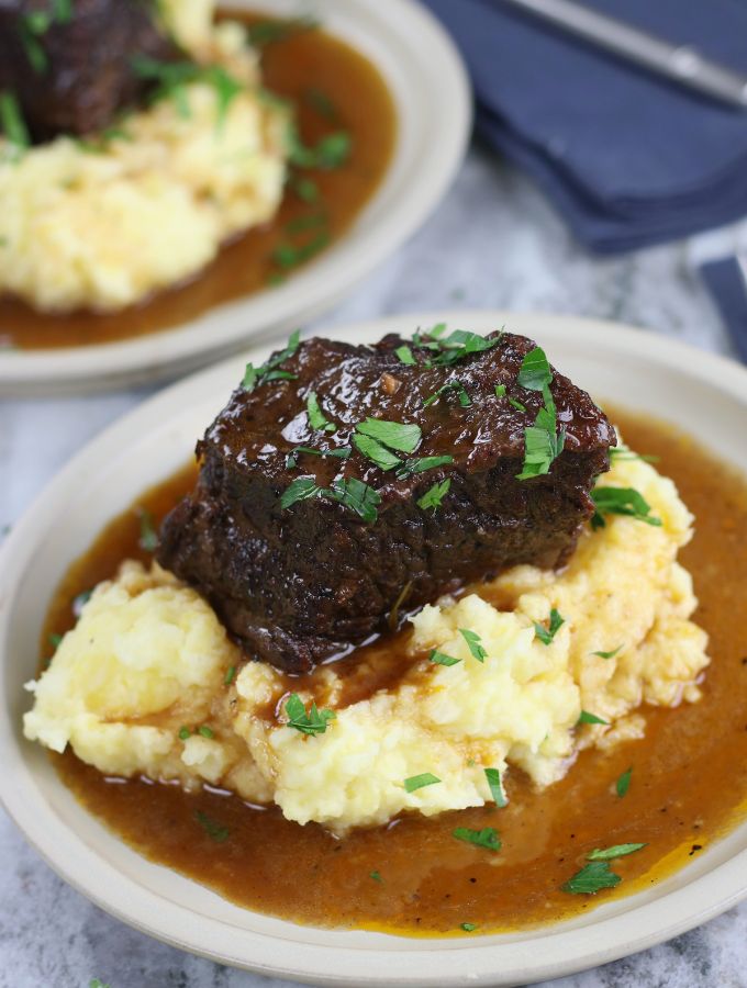Red Wine Braised Short Ribs served on top of mashed potatoes.