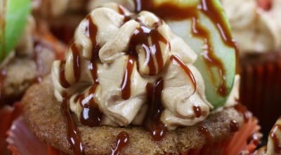 Up close photo of Caramel Apple Cupcakes with a caramel drizzle.