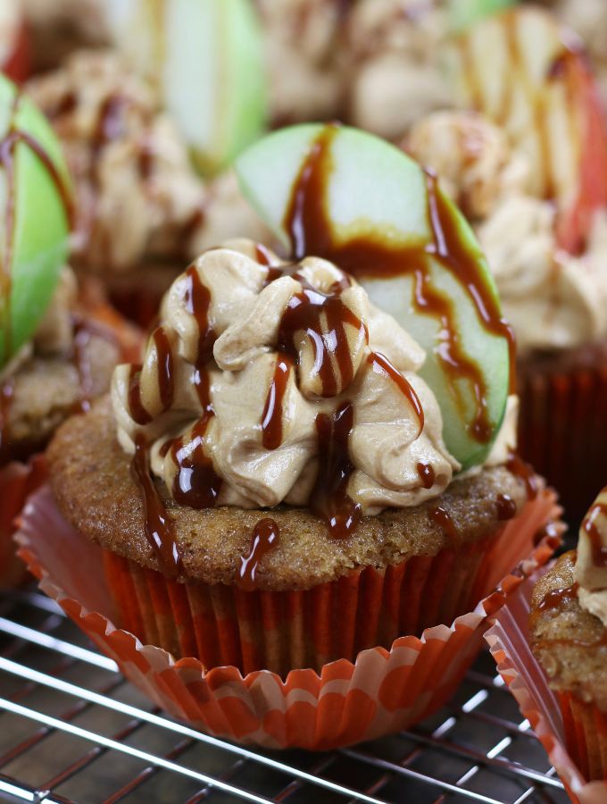 Up close photo of Caramel Apple Cupcakes with a caramel drizzle.