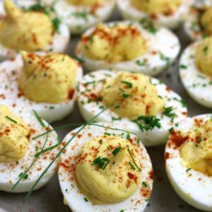 Up close photo of Classic Deviled Eggs garnished with fresh chopped chives.