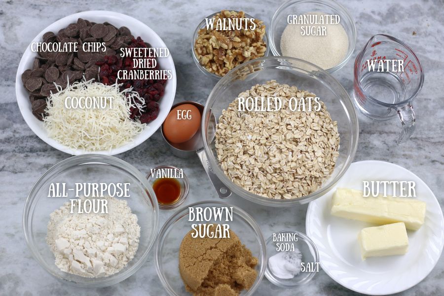 Ingredients for Oatmeal Cranberry Chocolate Chip Cookies measured into small bowls.