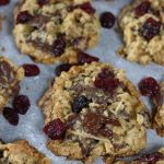 Up close photo of Oatmeal Cranberry Chocolate Chip Cookies laid in a single layer.