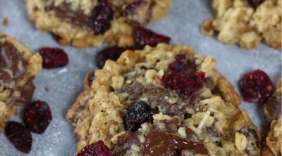 Up close photo of Oatmeal Cranberry Chocolate Chip Cookies laid in a single layer.