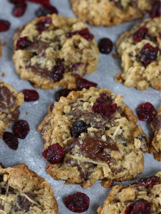 Up close photo of Oatmeal Cranberry Chocolate Chip Cookies laid in a single layer.