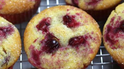 Overhead photo of Orange Cranberry Muffins on a cooling rack.