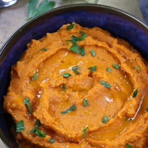 Whipped Sweet Potatoes in a blue serving bowl.