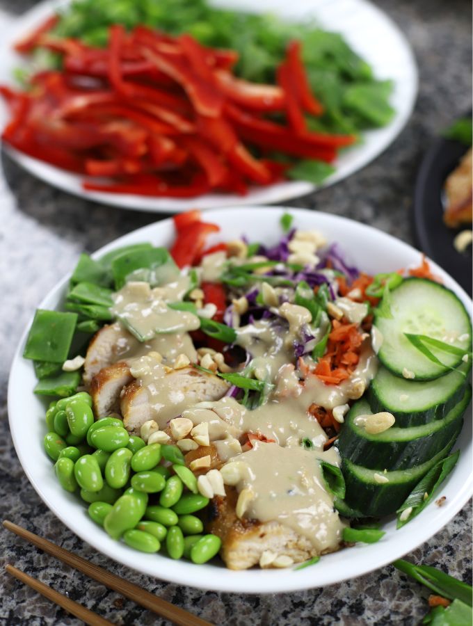 Asian Grain Bowl in a large white bowl sitting on a granite countertop.