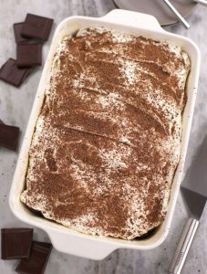 Overhead photo of Chocolate Sheet Cake in a white baking dish.