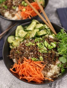 Ground Beef Bulgogi served with rice, carrots, micro greens and cucumber salad.