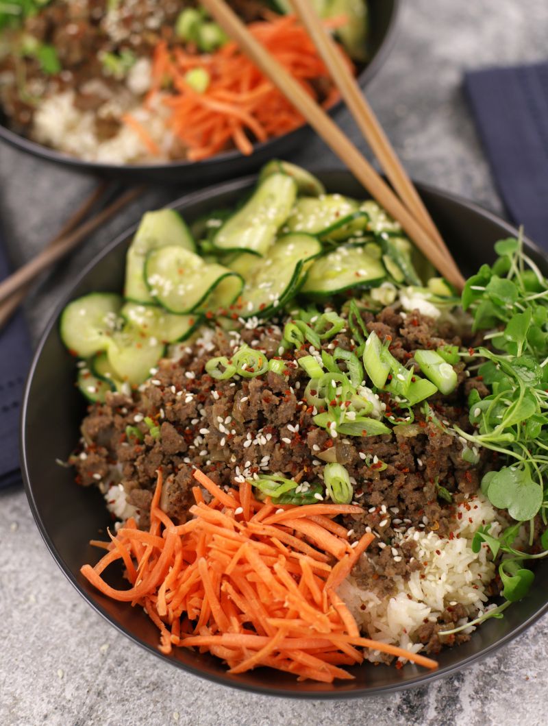 Ground Beef Bulgogi served with rice, carrots, micro greens and cucumber salad.