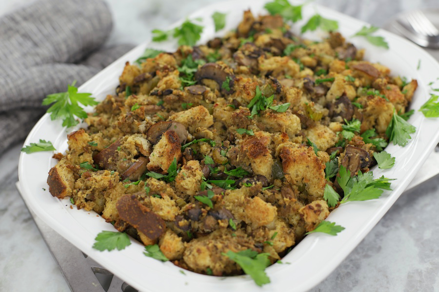 A large white glass casserole pan full of Sour Dough Bread Stuffing.