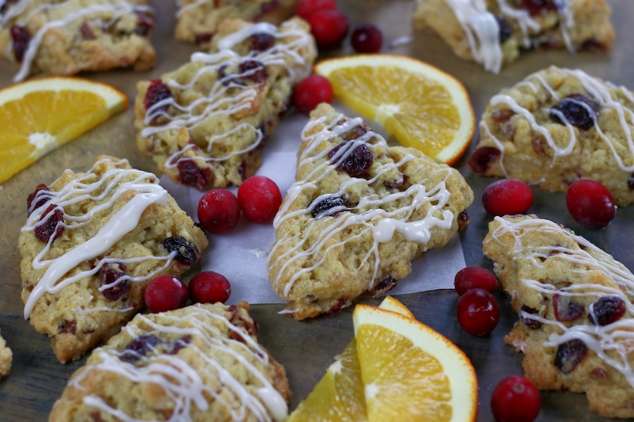 Several scones laid out flat from on a flat surface Cranberry and Orange Scone Recipe.