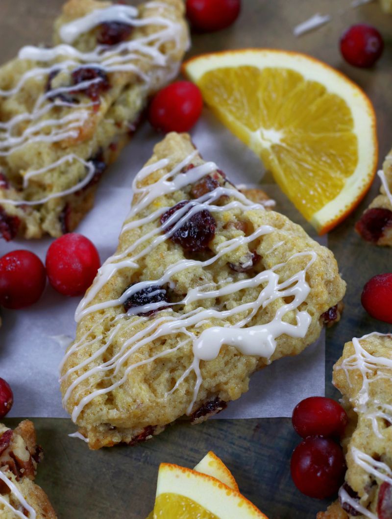 Up close photo of Orange Cranberry Scones with a drizzle of glaze.