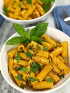 Anchovy Pasta made with rigatoni noodles and served in a white pasta bowl.