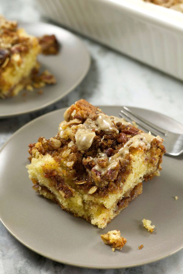A serving form Coffee Cake Recipe Using Sour Cream and glazed with a brown butter glaze.