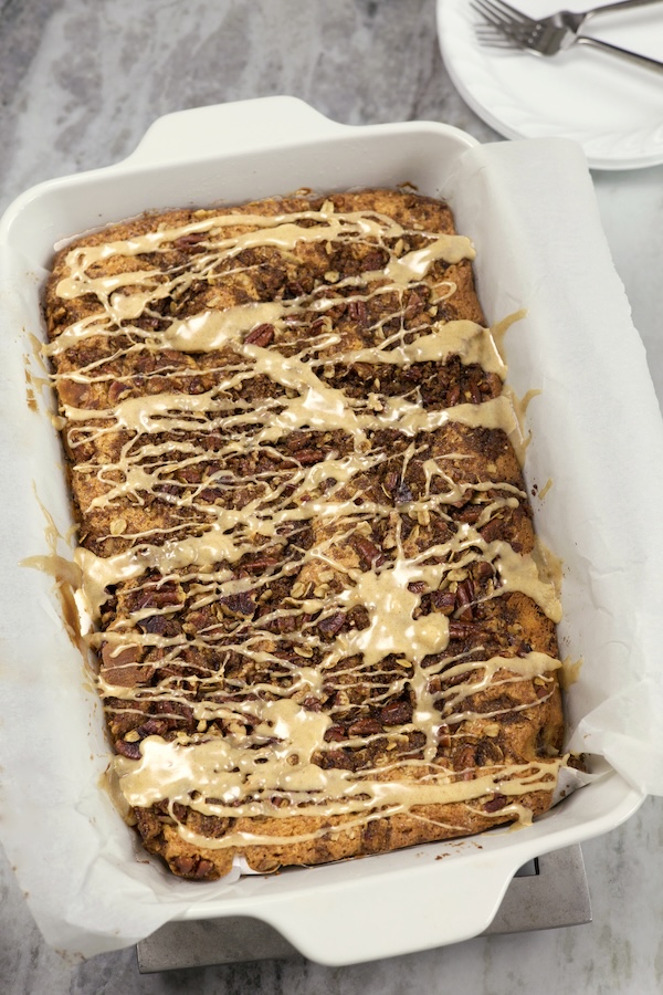 Overhead photo of Streusel Coffee Cake in a white glass 9x13 pan and glazed with a brown butter glaze.